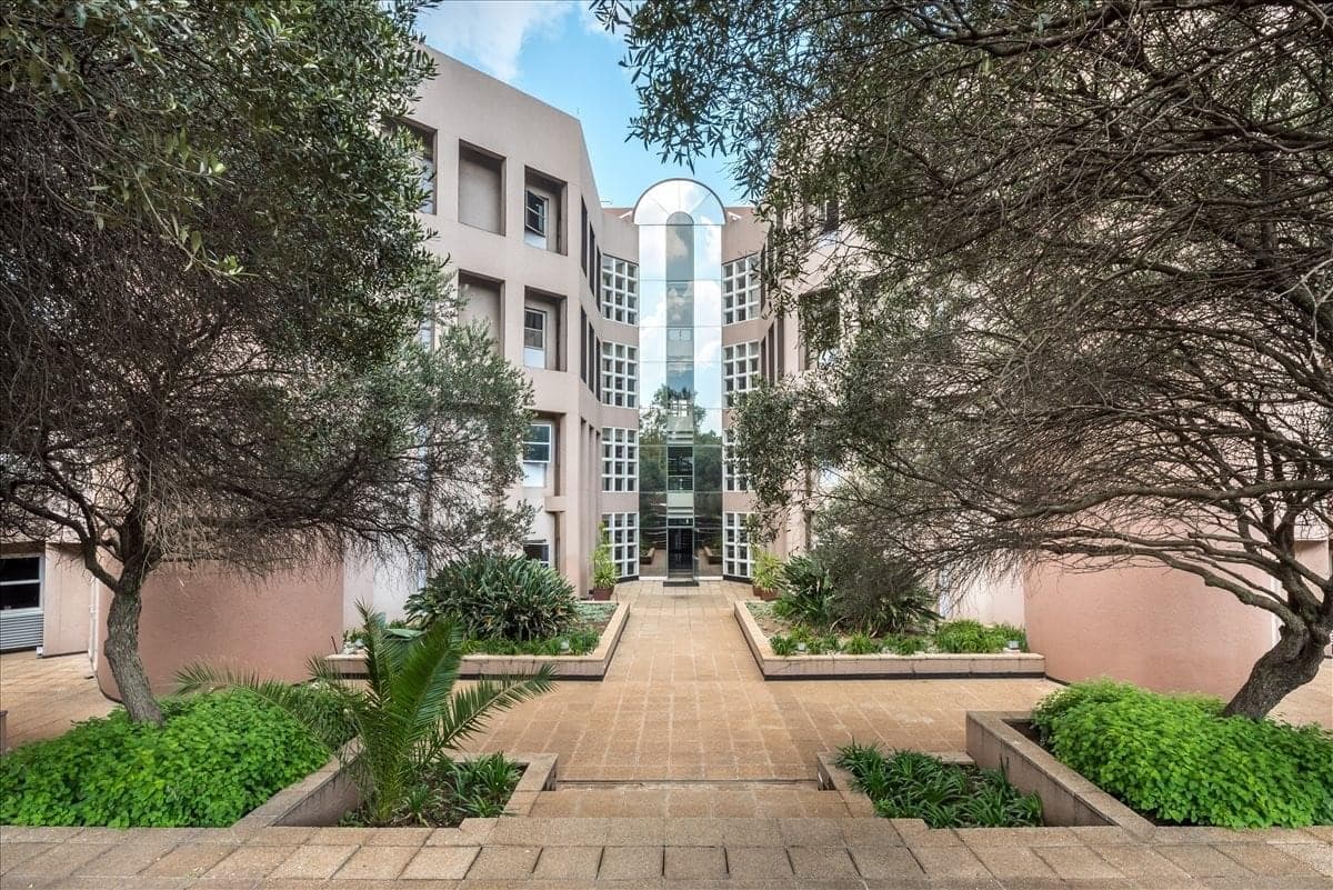 Landscaped courtyard and glass atrium at Metropolitan Park, 8 Hillside Road, Parktown, home of the Midford Legal Consultants head office